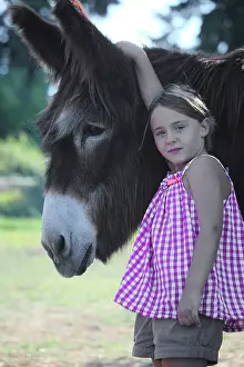 Asses: Girl holding a Donkey - France