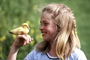 Easter: Girl holding DUCKLING