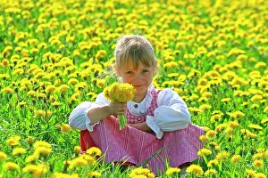 Child: Girl in meadow with dandelions