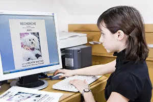 Preparing: Girl preparing a poster to find her lost dog