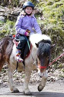 Helmets: Girl riding a poney Haut-Rhin France