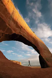 Peter Mather: Girl running in arch (Ava Cairns (Age 10 Model Released)