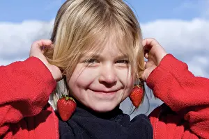Strawberries: Girl - with strawberries held up as earrings