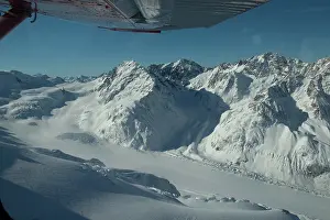 Plane: Glacier and snow-capped mountains - snowplane flight