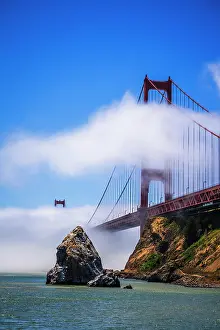 Bridge: The Golden Gate Bridge surrounded by fog, San Francisco