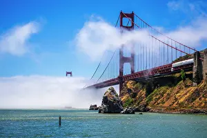 Bridge: The Golden Gate Bridge surrounded by fog, San Francisco