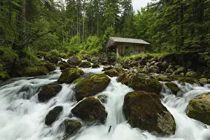 Typical: Golling watermill. Traditional mill in an alpine landscape