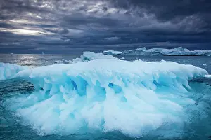 Eqip: Greenland, Ilulissat, Melting iceberg floating