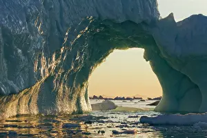 Arched: Greenland, Ilulissat, Setting midnight sun