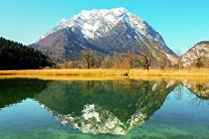 Styria: Grimming mountain reflected in the lake in spring
