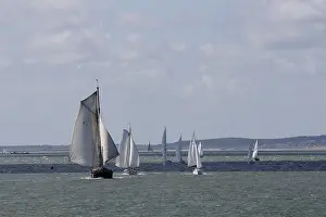 Sailing: Group of boats sailing on the wadden sea. The Netherlands