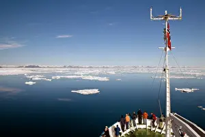 Deck: Group of people on deck of an Arctic expedition ship sailing