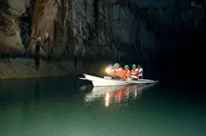Palawan: A group of tourists on a boat with a guide - inside