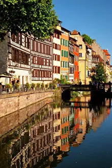 Half: Half-timbered buildings reflected in the
