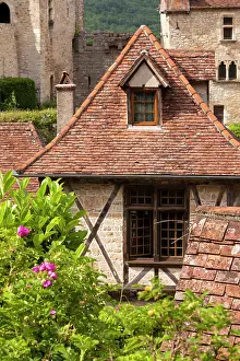 Half: Half-Timbered home in medieval Saint-Cirq-Lapopie