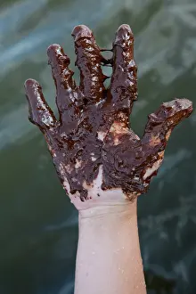 Oily: Hand covered in crude