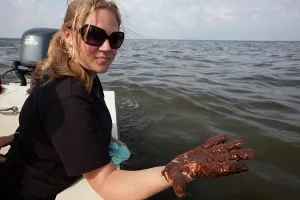 Cleanup: Hand covered in crude oil