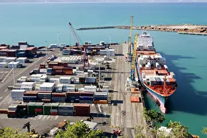 Docks: Harbour - containers stacked on quayside and container