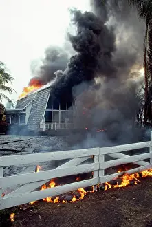 Volcanos: Hawaii Kilauea Volcano - home destroyed by lava flow