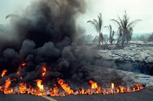 Volcanos: Hawaii Kilauea Volcano - lava advancing over aspalted street
