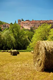 Farmers: Hay in a farmers field below Castel San