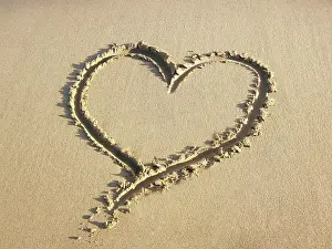 Angela Blackwood Murray: Heart drawn in the sand of a beach