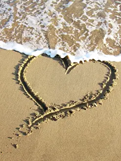 Angela Blackwood Murray: Heart drawn in the sand of a beach