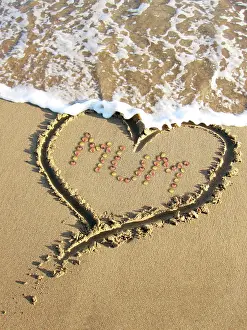 Angela Blackwood Murray: Heart drawn in the sand of a beach with Mum inside