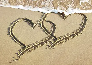 Angela Blackwood Murray: Heart - two drawn into sand with surf