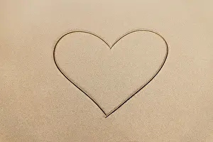 Character: Heart drawn on the tropical beach. Summer backgr