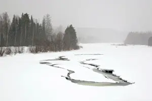 Reduced: Heavy snowfall and reduced visibility over river Sosva