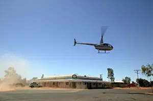 Helicopter: Helicopter landing at Birdsville Pub.Birdsville