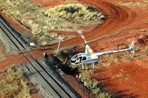 Pick: Helicopter and outback letterbox - aerial image.Twice