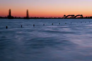 Forelands: high water after sunset with the Amerongen dam in the backgr