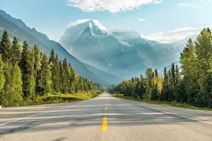 Sixteen: Highway, snow-capped mountains at the back, Mt Robson