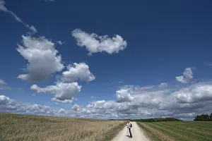 Path: Hiker on a field path in Franconian landscape