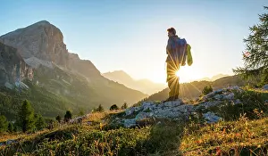 Beam: Hiker looking into the distance, sunrise, solar