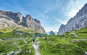 Veneto: Hiker, mountaineer on a trail between rocky mountains