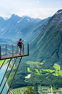 Platform: Hiker standing on viewing platform Rampestreken