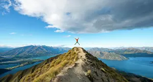 Mountaineer: Hiker takes a skydive, views of mountains and lake