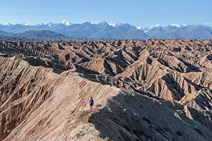 Experience: Hiker walking along a canyon, Tian Shan mountains
