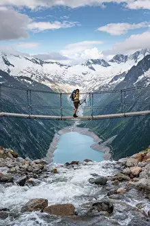 Suspension: Hiker, woman on suspension bridge at the Olpererhutte