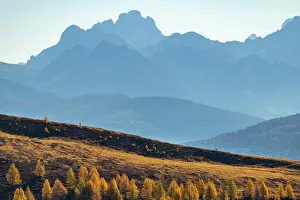 Hikers: Hikers on autumnal ridge with Peitlerkofl in the