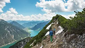Hikers: Two hikers on hiking trail, crossing from Seekarspitz