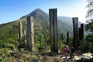 Wisdom: Hikers in front of wooden stelae at Wisdom Path