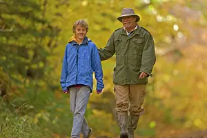 Alongside: Hiking - father and son walking alongside American