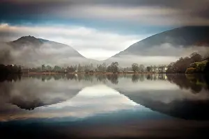 Cumbria: Hilly landscape with trees reflected in water surface