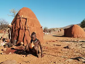 Butter: Himba boy with the typical single plait hairstyle