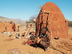 Butter: Himba boy with the typical single plait hairstyle