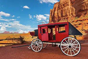 Table: Historic carriage at Monument Valley, cloudy sky